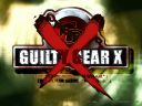 A wallpaper of the Guilty Gear X logo on a blurry green ripple texture.