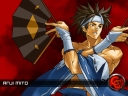 A wallpaper of Anji Mito on a red background with the Guilty Gear 'GG' logo.