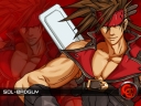 A wallpaper of Sol Badguy on a red background with the Guilty Gear 'GG' logo.